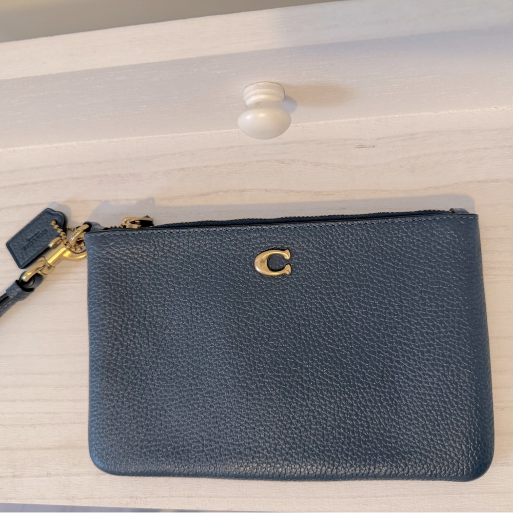Coach NWOT Denim Blue wristlet.